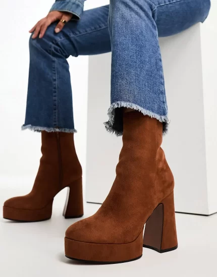 Enchant heeled platform boots in tan micro