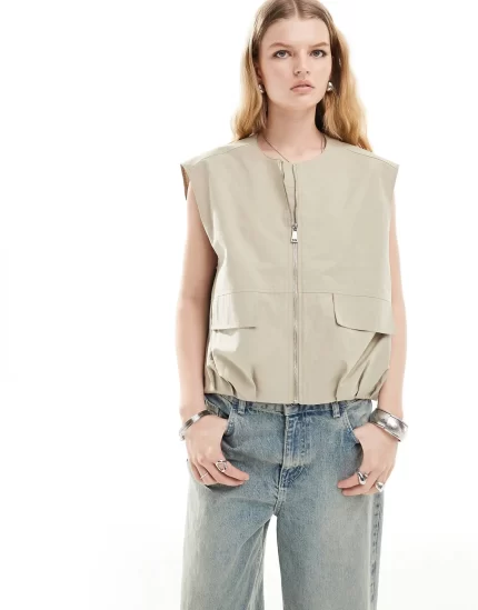 sleeveless collarless utility gilet in stone